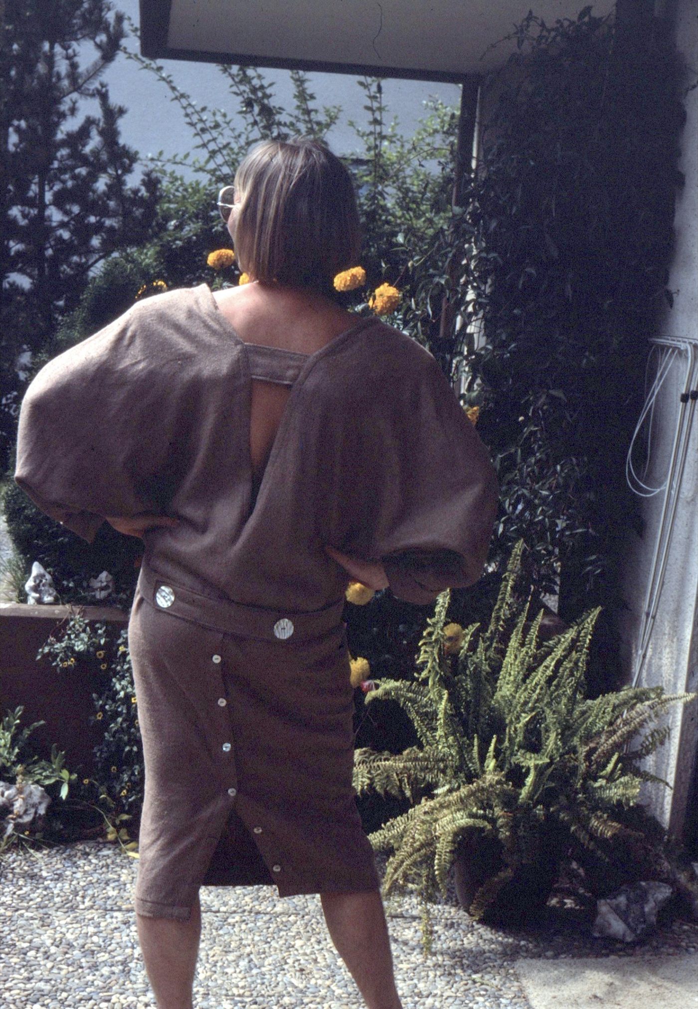 Back view of a self-designed dress with a button placket